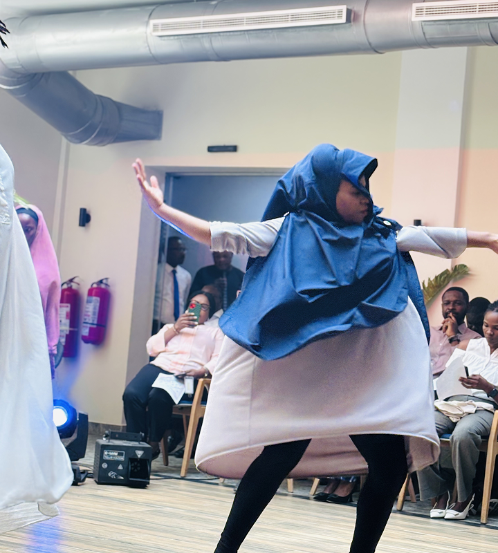 Dancers in colorful traditional attire in an artistic pose